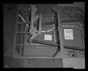 [Photograph of wiring and tubing beneath the flooring of a UH-1B Iroquois helicopter, 2]