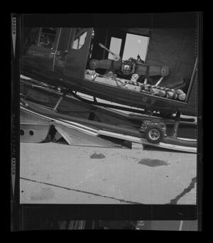 [Photograph of a side view of a YUH-1D Iroquois helicopter on a ramp]