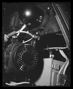 [Photograph of a closeup of some mechanical components inside a UH-1E Iroquois helicopter]