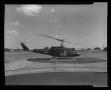 Thumbnail image of item number 1 in: '[Photograph of a side view of a UH-1C Iroquois helicopter facing the right, 2]'.