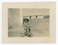 Photograph: [Gladys riding a tricycle]