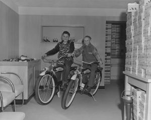 [Portrait of Two Boys Sitting on Bicycles]