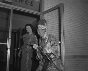 [Bobby Peters and an unidentified woman in costumes]