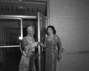 [Bobby Peters and an unidentified woman in costume]