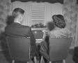 Photograph: [Man and woman watching television]