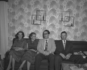 [Two men and two women on a couch, 2]
