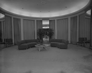 [Oval room with sofas and table]