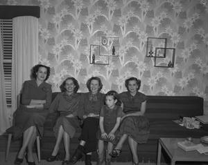 [Four women and a young girl]