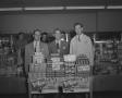 Photograph: [Three Men with Products]