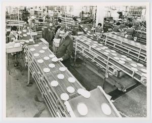 [Frank Cuellar Sr. overseeing the assembly line]
