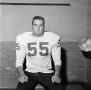 Photograph: [Football player sitting on a bench, 5]