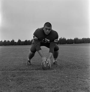[Football player leaning on the ball, 7]