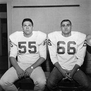 [Two football players with shoulder pads, 8]