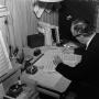Photograph: [Ellis composing in office]