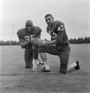 [Two football players kneeling together, 4]