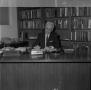 Photograph: [Dr. L.F. Connell at his desk, 7]