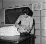 Photograph: [Woman performing CPR, 2]