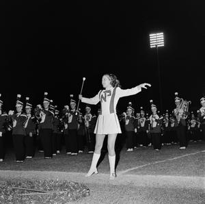 [NTSU majorette with the marching band]