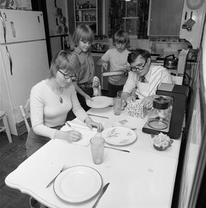 [Coomes family in their kitchen, 5]
