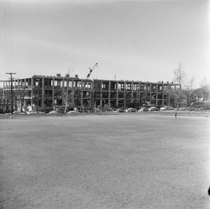 [Crumley Hall construction and field]