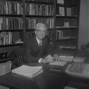 [Dr. L.F. Connell at his desk, 16]