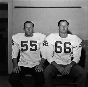 [Two football players with shoulder pads, 15]