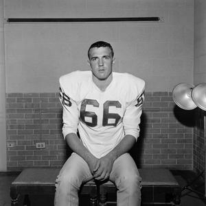 Primary view of object titled '[Football player sitting on a bench, 8]'.