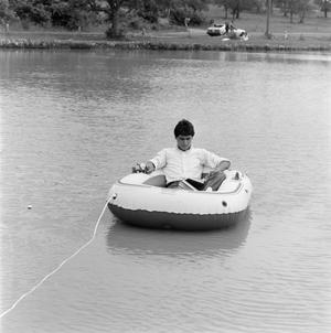 [Man reading on a boat, 7]