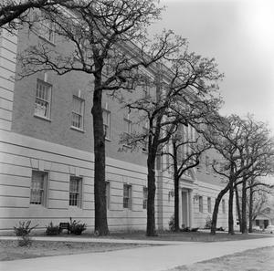 [exterior of Matthews Hall by trees]