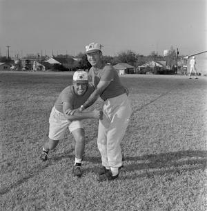 Primary view of [Two NTSU football coaches]
