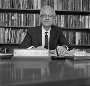 [Dr. L.F. Connell at his desk, 19]