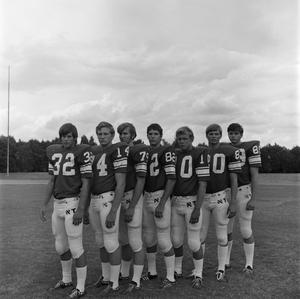 [Seven football players in a line, 3]