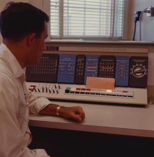 [Man sitting in front of an IBM 1620, 4]