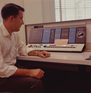 Primary view of object titled '[Man sitting in front of an IBM 1620, 6]'.