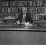 Photograph: [Dr. L.F. Connell at his desk, 12]