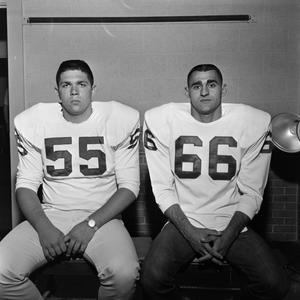 [Two football players with shoulder pads, 7]