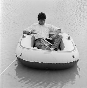 [Man reading on a boat]