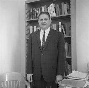 [Photograph of Dr. Friedsam in his office]