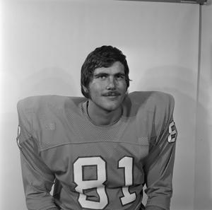 [Football player with a mustache sitting, 16]