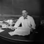 Photograph: [Mr. Gibson at his desk #2]