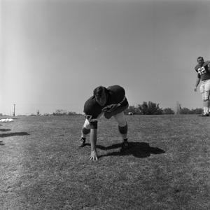 [Football player #67 Clyde Herbert and #62 Bob Tricks]