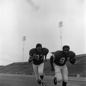 [Two football players running, 13]