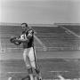 Photograph: [Football player number 81 holding a football]
