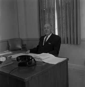 [Photograph of Dr. Gafford at his desk #8]