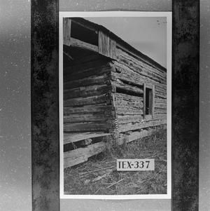 [Photograph of a log cabin #1]