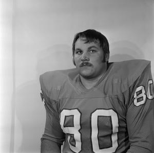 [Football player with a mustache sitting, 13]