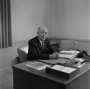 [Photograph of Dr. Gafford at his desk #6]
