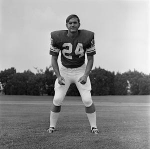 [Football player #24 from the 1971 season standing square to the camera]
