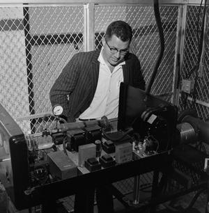 [Dr. Bruce Foster working on a machine, 2]