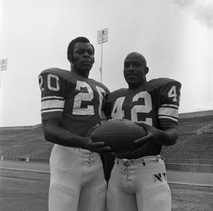 [Two football players holding a ball, 5]